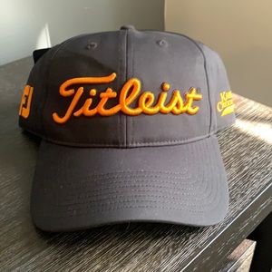 Titleist, Black and Orange Hat. NWT. Performance material